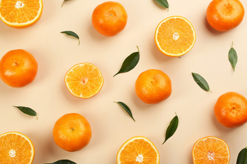 Flat lay composition with tangerines on beige background