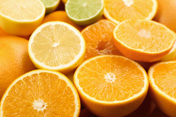 Closeup view of cut tangerines, oranges, lime and lemon