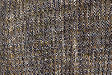 Fototapeta premium Fountain wall made of small stones. Brilliant colorful marble mosaic flooded with water. Texture background.