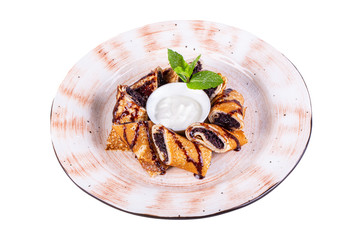 Sweet pancakes with poppy and sour cream