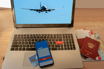 Online search and booking of flight tickets using a laptop and smartphone