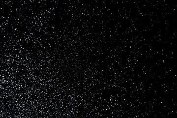 Abstract christmas bokeh blurred lights like snowflakes in the dark night sky background.