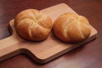 fresh bread on wooden cutting board