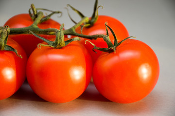 fresh tomatoes on black background