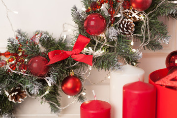 Christmas decorations with firtree, cones, toys, and candles