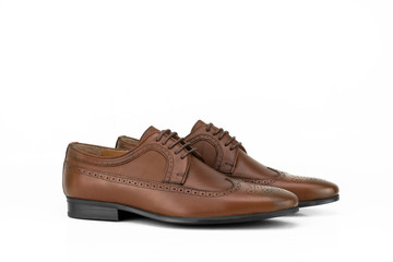 Brown brogue leather derby isolated on white.