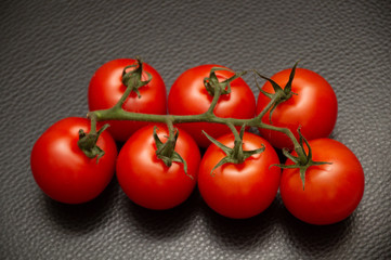 fresh tomatoes on black background
