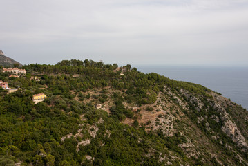 Landscape with high hill over the sea. Houses and forrest seen from Eze Village, French Riviera. 