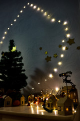 Obraz premium christmas paper city with lights