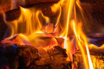 Close up of burning logs and coal in fireplace