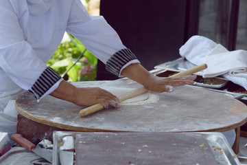Woman cooking cakes gozleme.