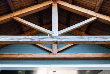 Wooden roof rafter beams. Architectural detail and design. - 305519427