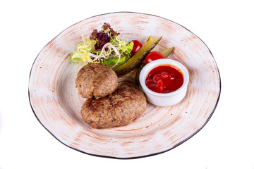 Beef meat cutlets, served with ketchup and salts