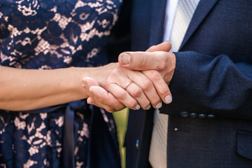 Old middle aged people holding hands close up view, family couple express care concept happy...