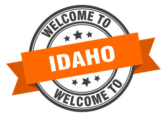 Idaho stamp. welcome to Idaho orange sign