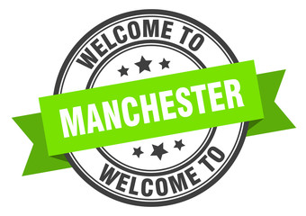 Manchester stamp. welcome to Manchester green sign