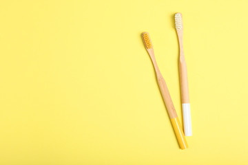 natural bamboo toothbrushes on an open background top view. Oral and dental care.