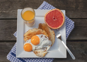 breakfast with fried eggs and coffee