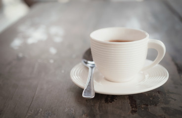cup of coffee on wooden table