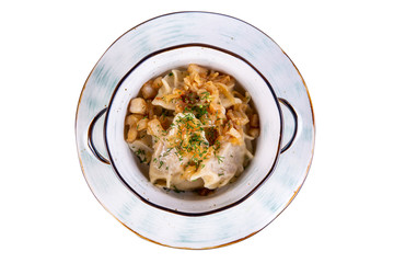 Vareniki with fried lard and fried potatoes with greens