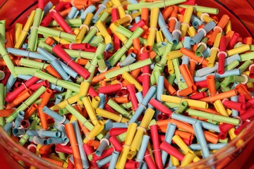 many colorful tombola tickets are lying in a bowl