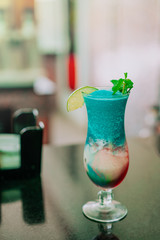 Colorful tropical coctail on the bar counter in the hotel. Resort