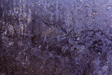 Frozen drops of water on glass, background