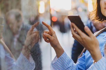 Close up image of female hand checking the route on public map and offline map on smartphone while...