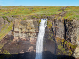 Fototapeta na wymiar View of the landscape of the Haifoss waterfall in Iceland. Nature and adventure concept background.
