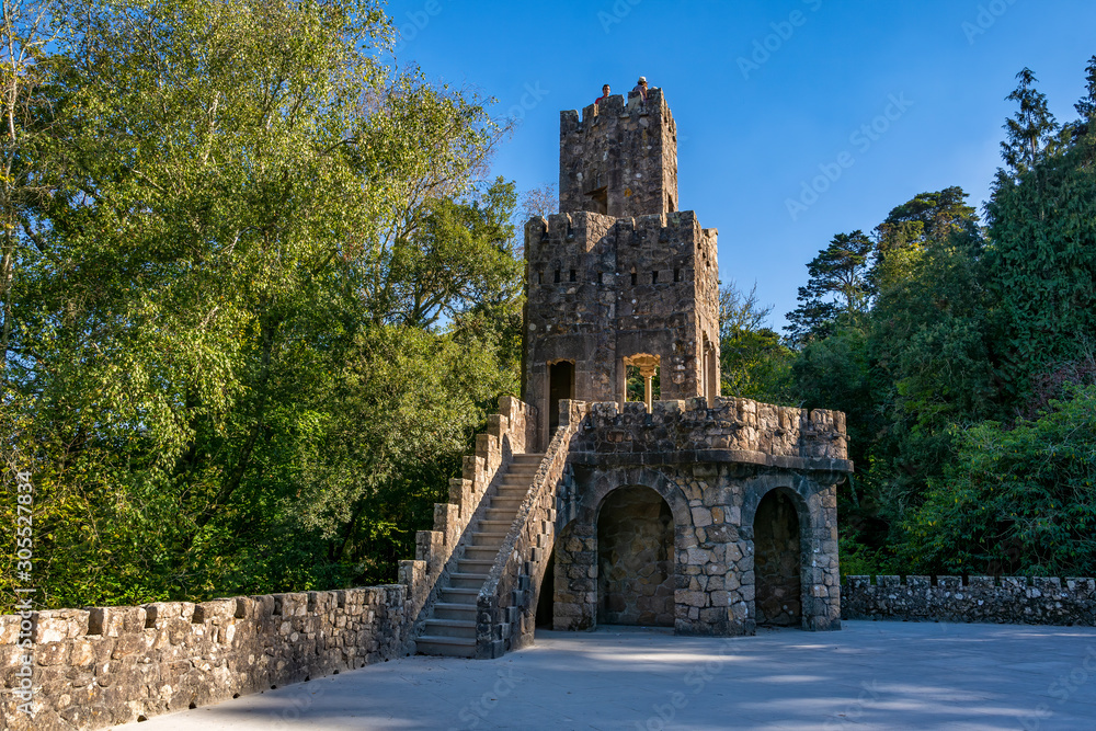 Poster Quinta da Regaleira, Portugal, Sintra. Eccentrically decorated palace and gardens with grottoes, fountains,  tunnels, caves, statues. UNESCO World Heritage Site.