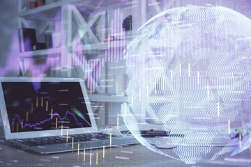 Financial graph colorful drawing and table with computer on background. Double exposure. Concept of international markets.