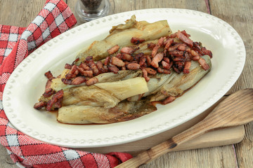 braised endives with bacon in a dish