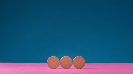 Three blank wooden cut circles placed in a row
