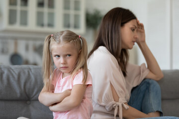 Naughty stubborn child daughter and mum avoid talk after argument
