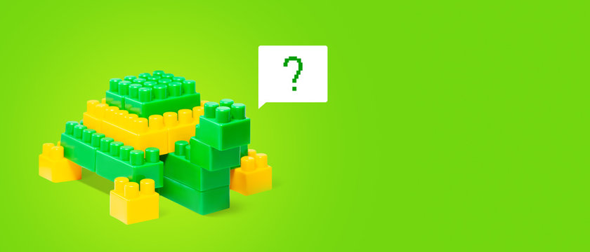 Pixelate toy turtle with question mark background