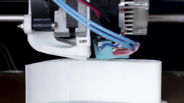 Close-up moving time lapse of a working 3d printer machine printing a PLA platic aircraft wing profile from begining to end.
