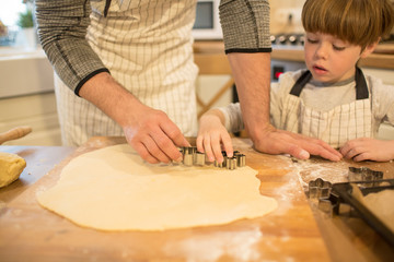 Fototapeta na wymiar Dad and son make cookies