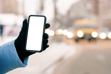 Woman is holding a blank screen mobile phone with copy space for text or for online bus route.