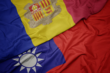 waving colorful flag of taiwan and national flag of andorra.