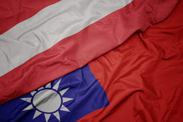 waving colorful flag of taiwan and national flag of austria.