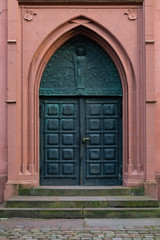 Entrance and doot to gothic protestant church in Michelstadt, Hesse, Germany.