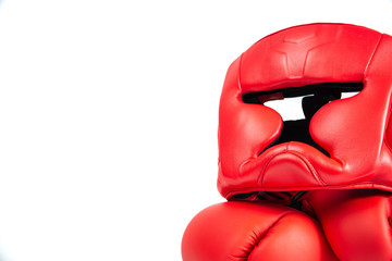 Boxing helmet and boxing gloves isolated on white. The concept of sport and active leisure....