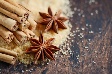 Christmas Spices Star Anise Cinnamon on a Wooden Table.