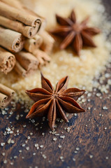 Christmas Spices Star Anise Cinnamon on a Wooden Table.
