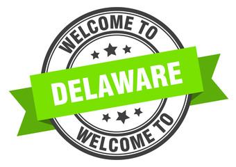 Delaware stamp. welcome to Delaware green sign