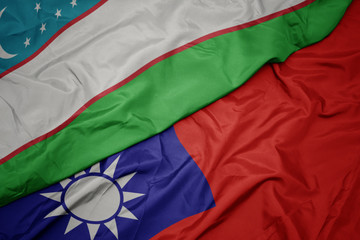 waving colorful flag of taiwan and national flag of uzbekistan.