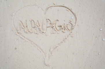 Heart drawn in the sand. Navagio Beach or Shipwreck Beach text in sand.
