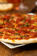 closeup of a salami pizza