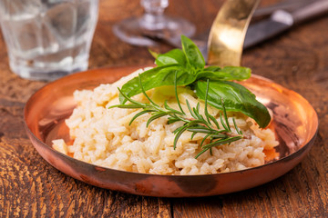 italian risotto with spices on wood