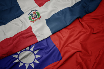 waving colorful flag of taiwan and national flag of dominican republic.